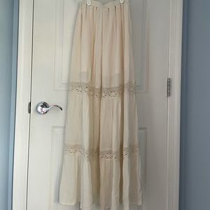 Women’s long prairie skirt with lace detail.
